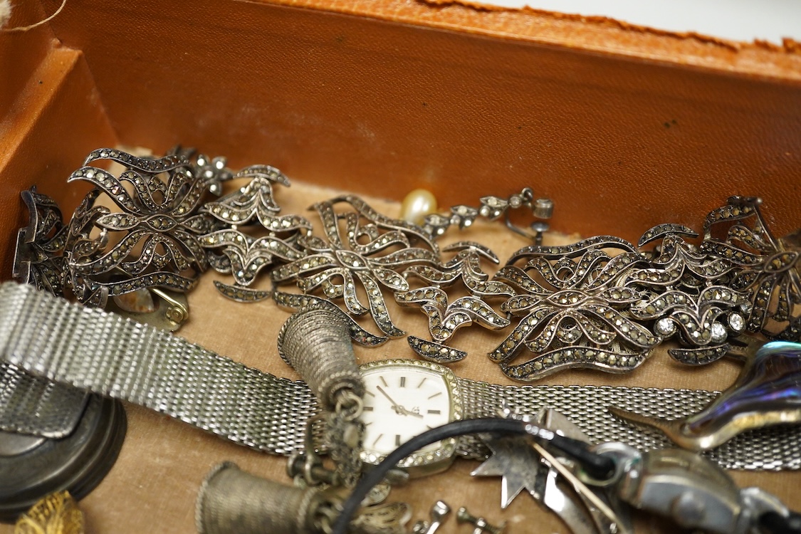 A quantity of assorted antique and later costume jewellery to include a silver and Marcasite ladies fob watch, a collection of cufflinks, brooches and a pair of drop earrings with screw backs